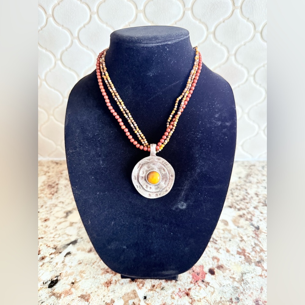 Hammered Metal pendant with beaded chain.  10”to 11”